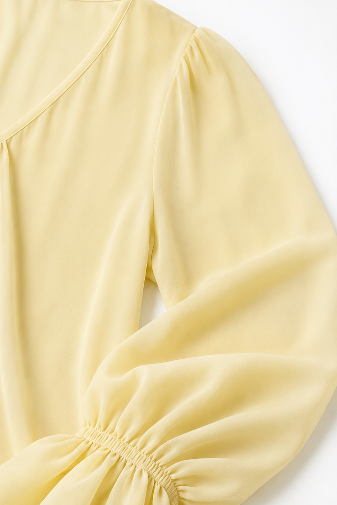 Pleatrelle – V-Neck Pleated Blouse With Ruffled Cuffs