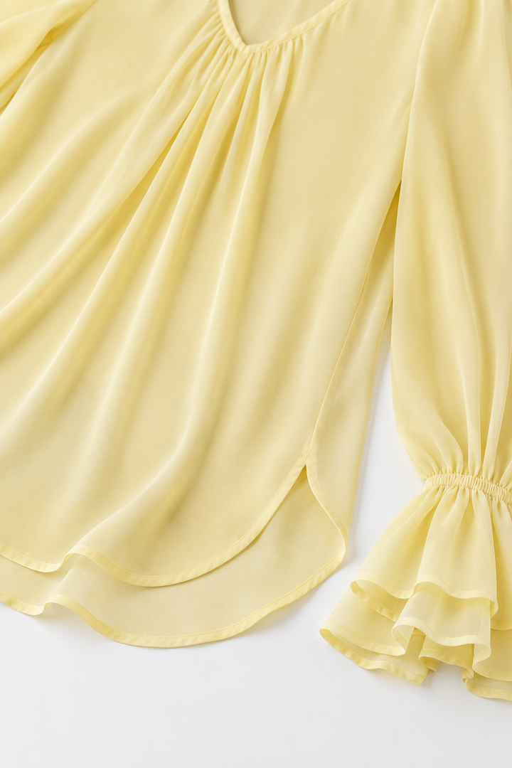 Pleatrelle – V-Neck Pleated Blouse With Ruffled Cuffs