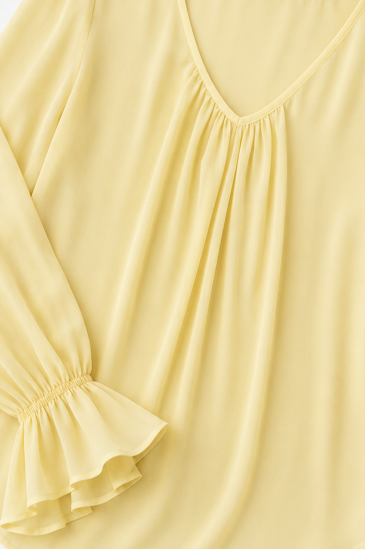 Pleatrelle – V-Neck Pleated Blouse With Ruffled Cuffs