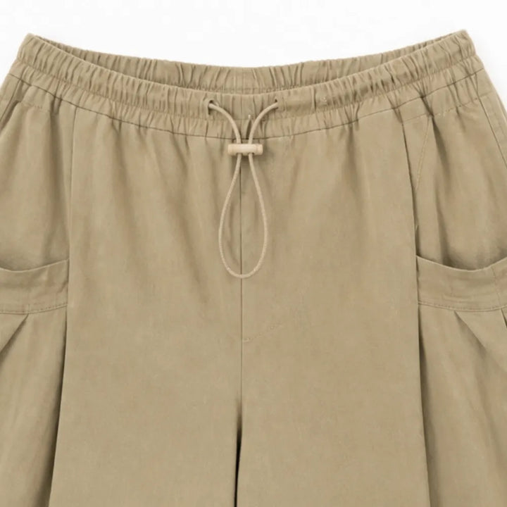 Lorenza – Pleated Wide-Leg Lantern Trousers with Drawstring Waist and Deep Pockets