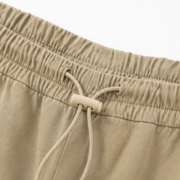 Lorenza – Pleated Wide-Leg Lantern Trousers with Drawstring Waist and Deep Pockets