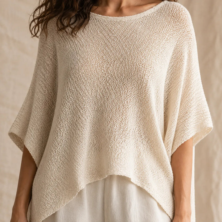 Solvera – Open Knit Batwing Top with Asymmetric Hem
