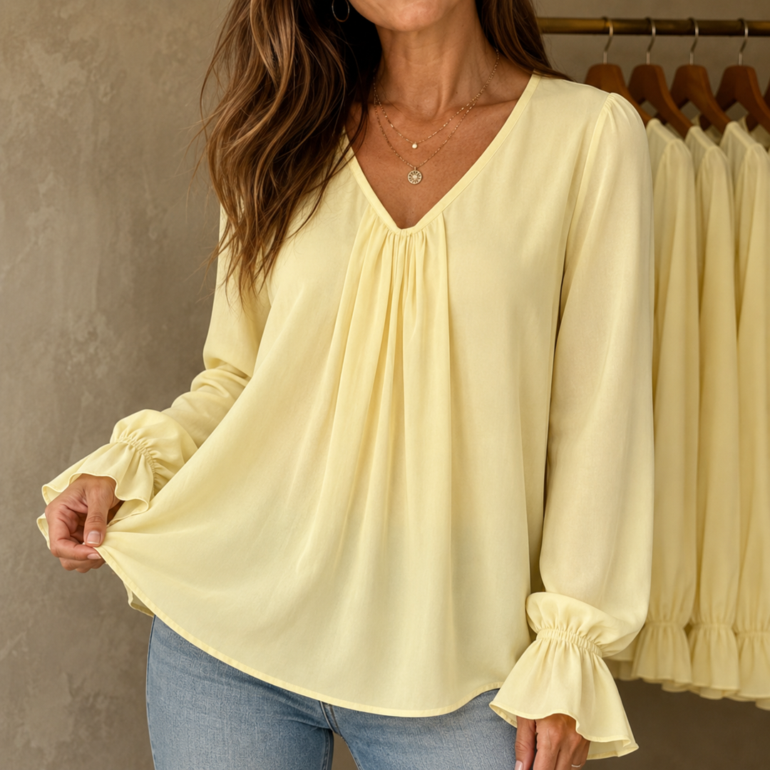 Pleatrelle – V-Neck Pleated Blouse With Ruffled Cuffs
