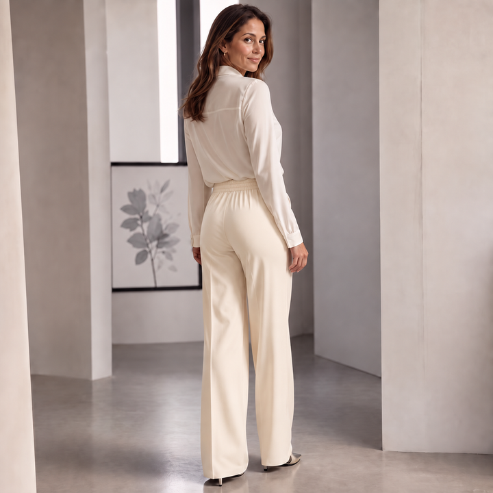 Veloura – High-Waisted Pleated Stretch Trousers