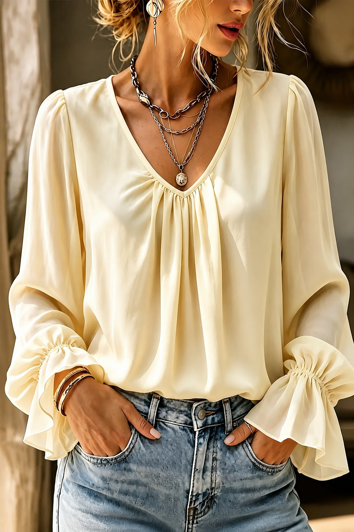 Pleatrelle – V-Neck Pleated Blouse With Ruffled Cuffs